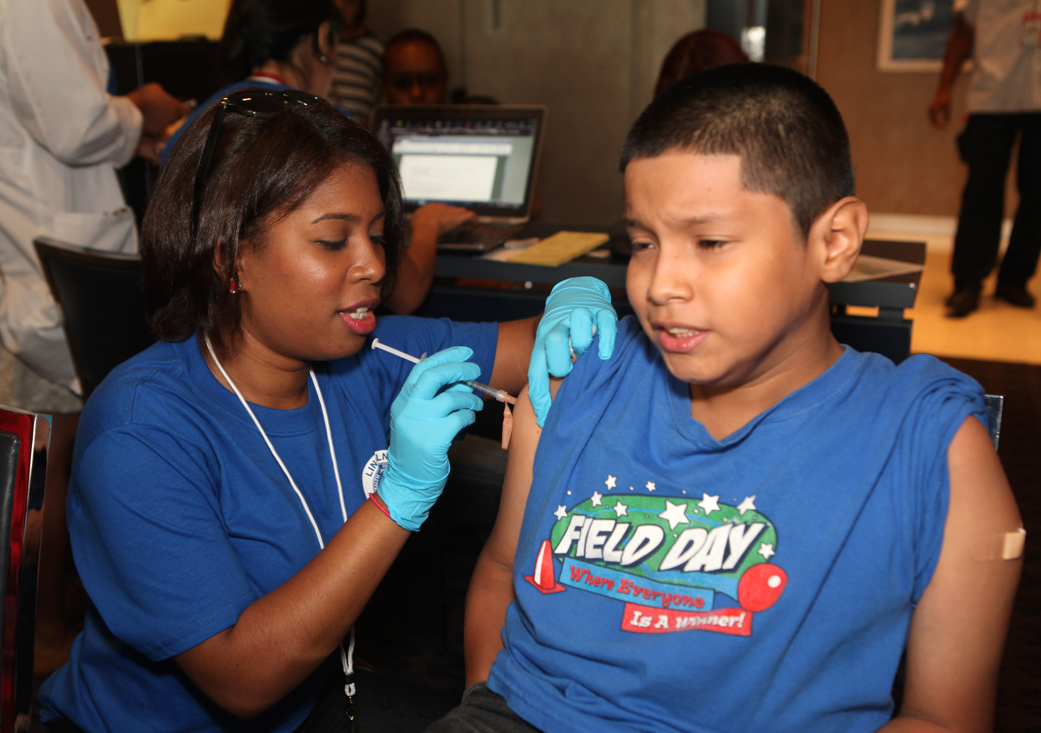 A Lincoln nurse administers a vaccine. (33116)