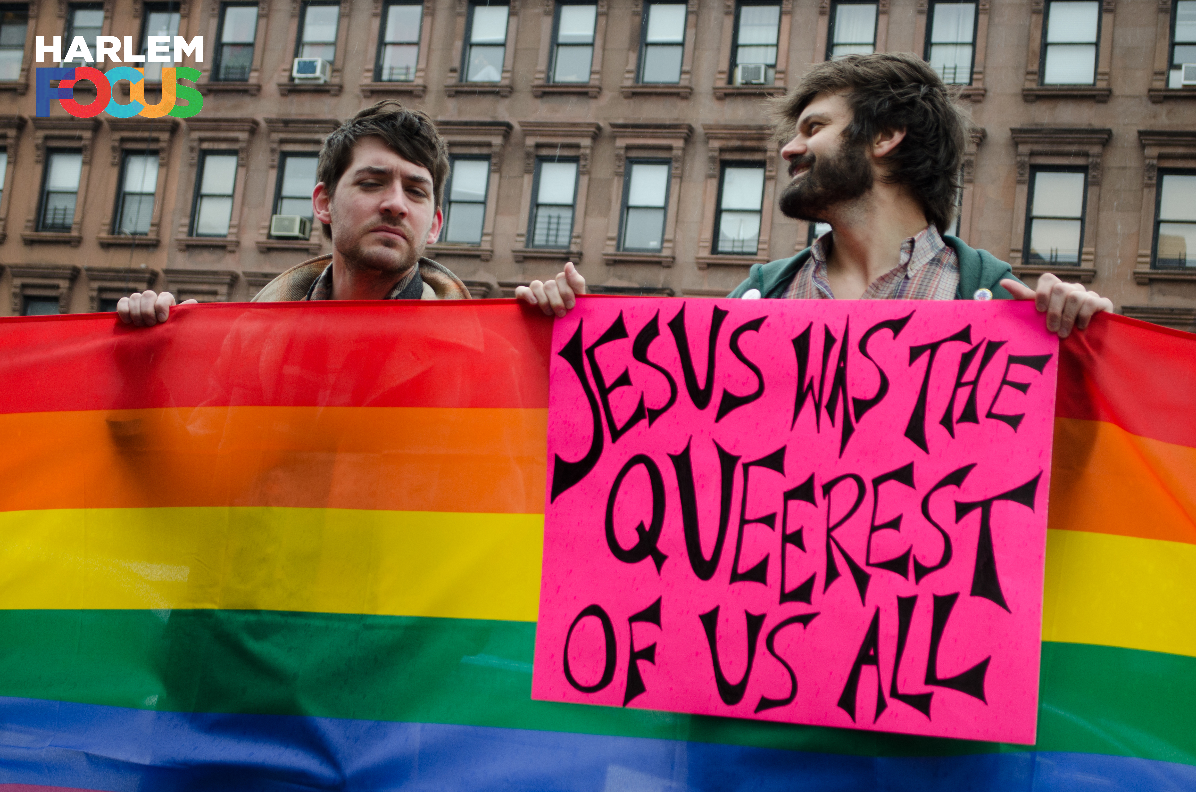 March 29th, 2014. Two protesters stand in the rain in front of the ATLAH Church in West Harlem. Micah Bucey, a Christian minister in the East Village, holds the sign which reads,