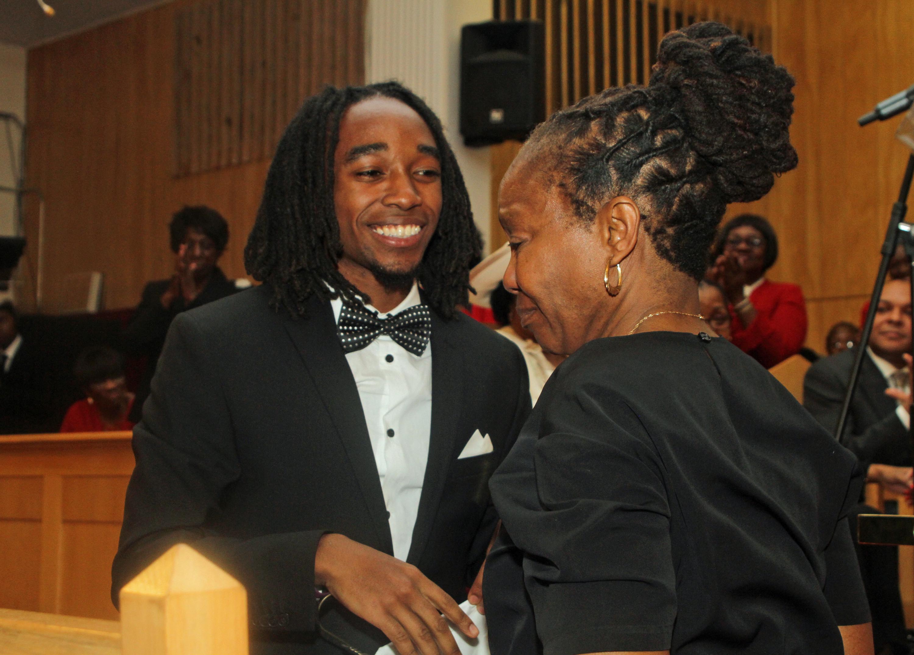 Jakeem congratulates his Mom, the newly ordained Rev Jolly (103080)