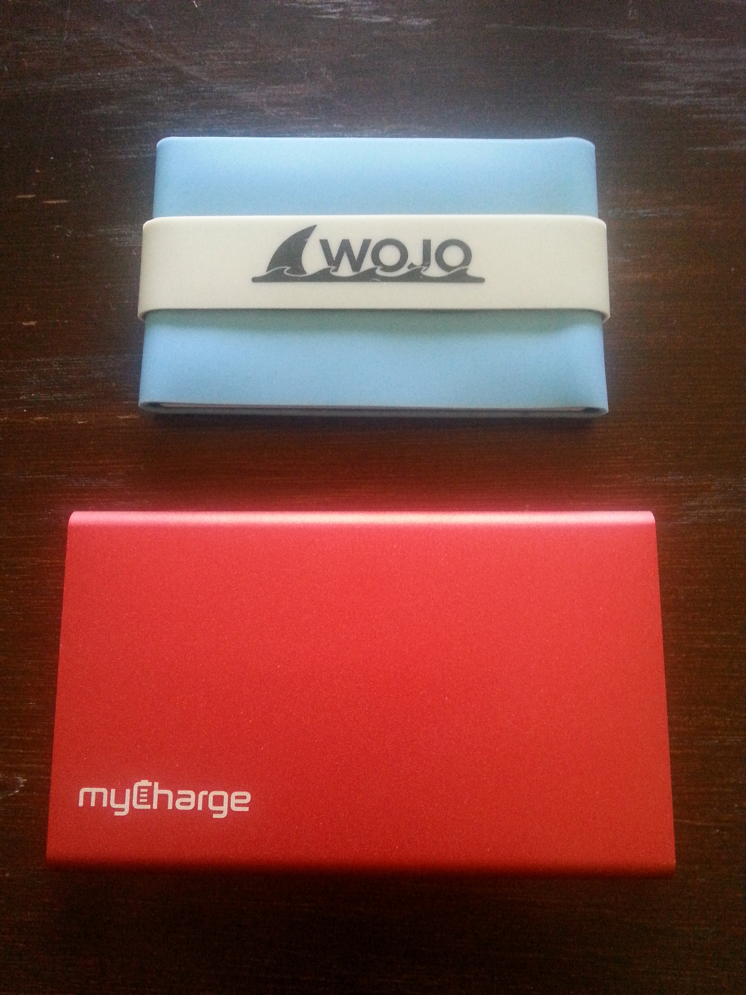 The Wojo Wallet is a very slim silicone, neoprene-lined sleeve that is water resistant and floats, and the myCharge RazorPlus is a fashionable, functional and lightweight phone charger crafted from anodized aluminum. (129863)