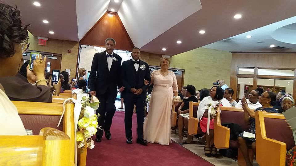 The groom Dr. Marcus Bright and his parents. (250019)